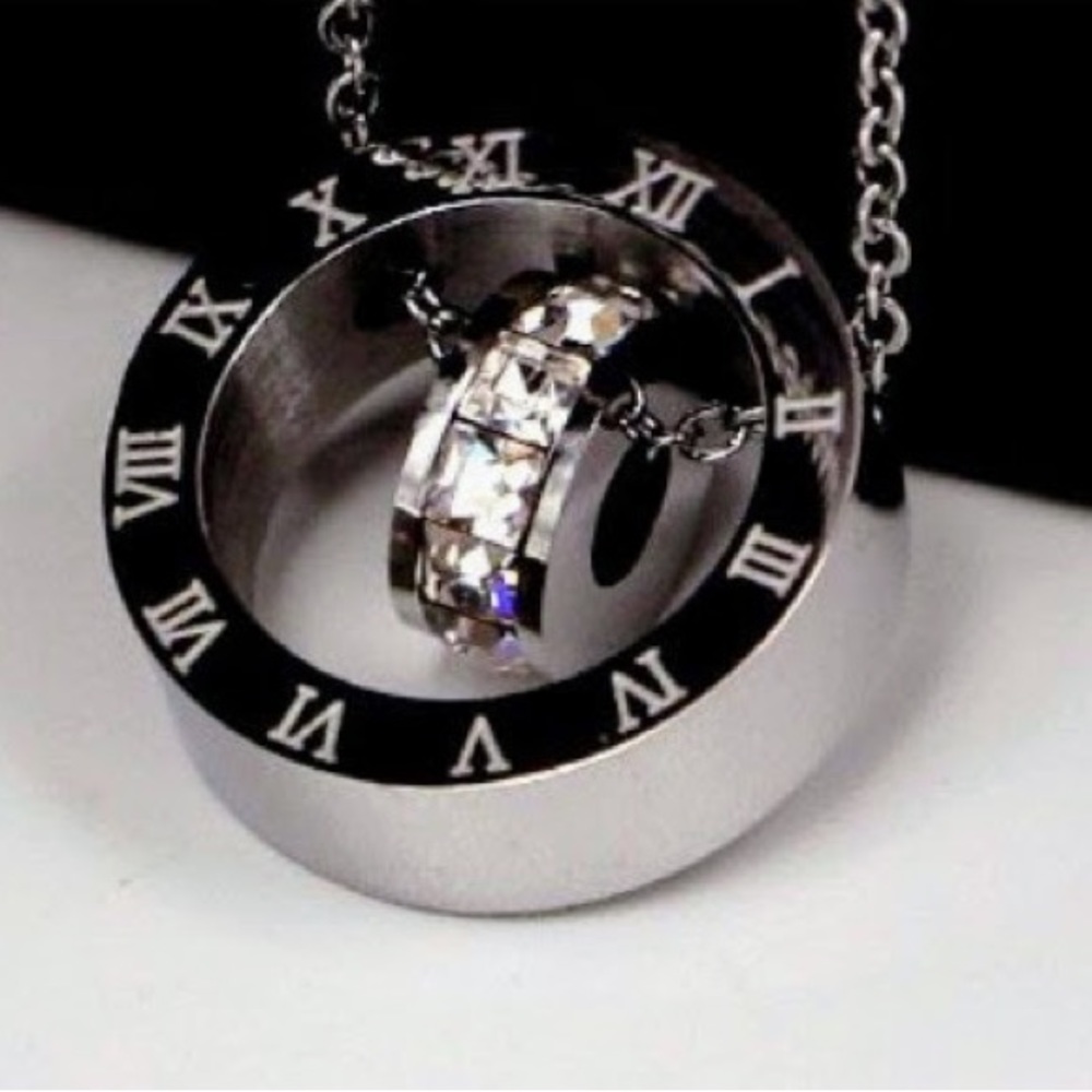 Stainless Steel, beautiful, 18 inch chain and pendant. Roman numeral sty…